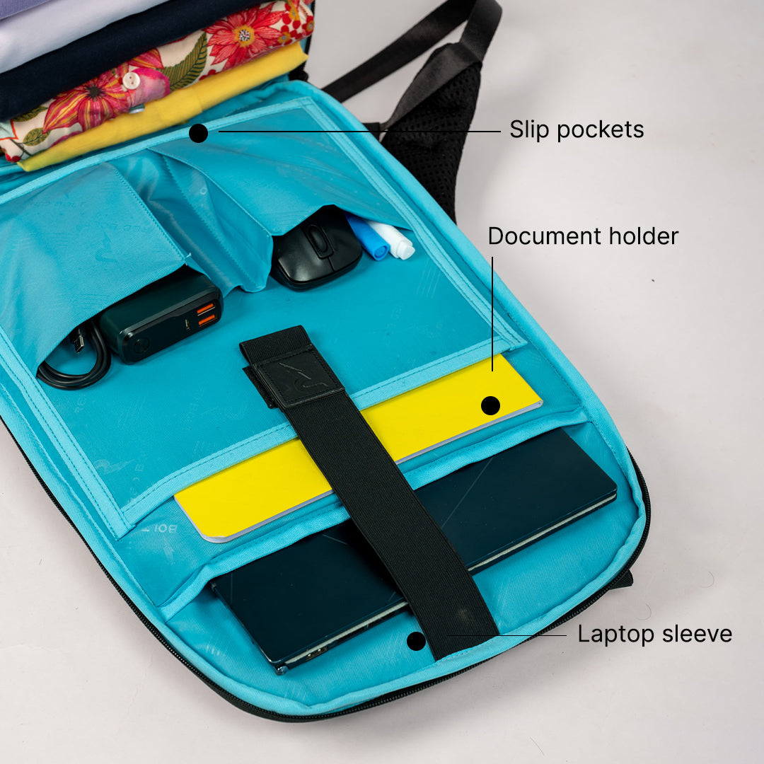 Packed interior of Redbolt Nebula backpack with laptop sleeve and accessory organization | black